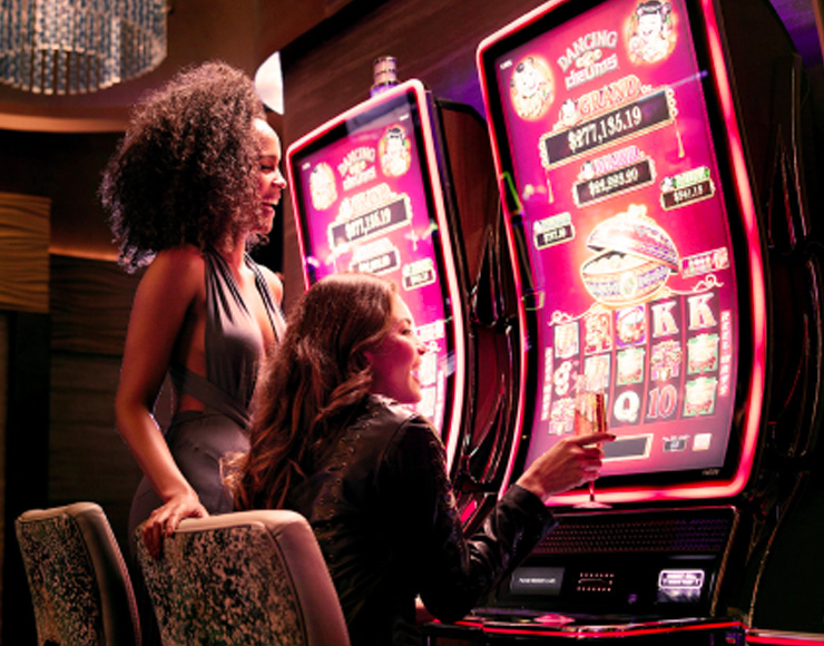 couple of friends playing slots