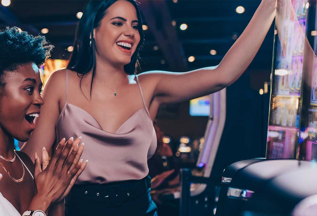 ladies playing on slot machines