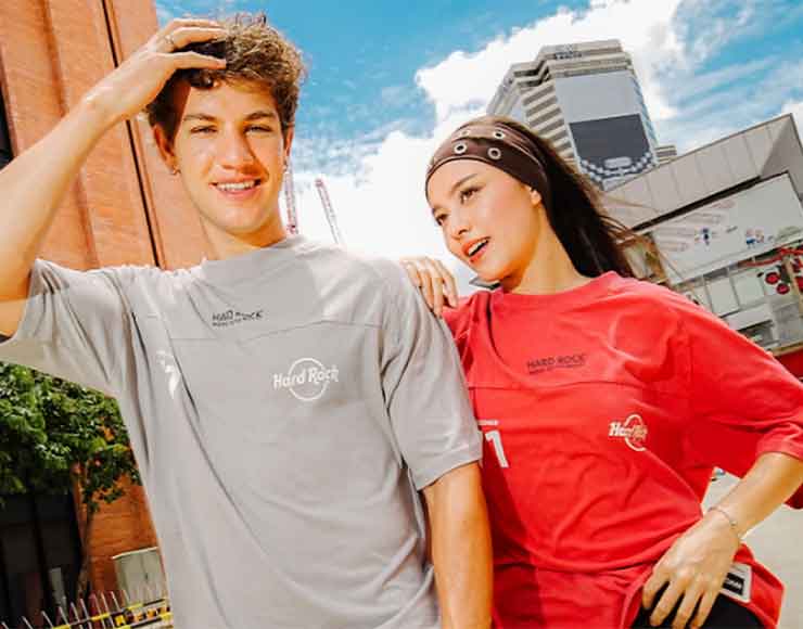 Man and woman wearing rock shop limited time tees.