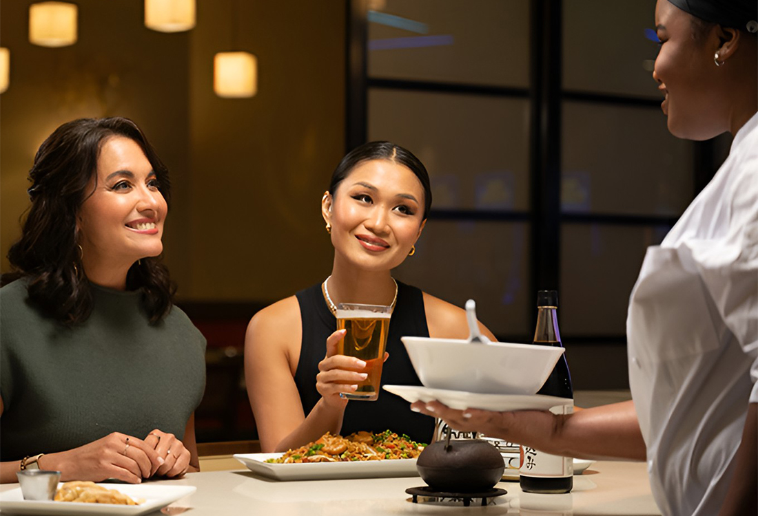 Women at a table getting served