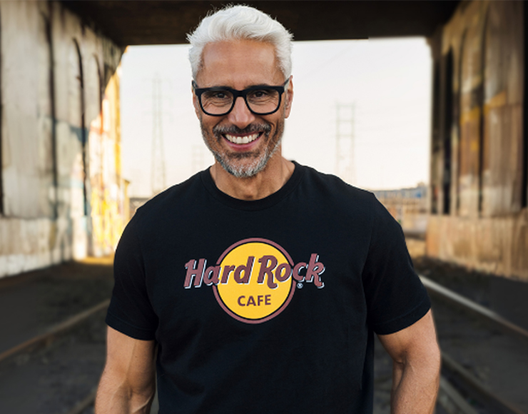 Man wearing classic Hard Rock tee in black for Father's Day Sale.
